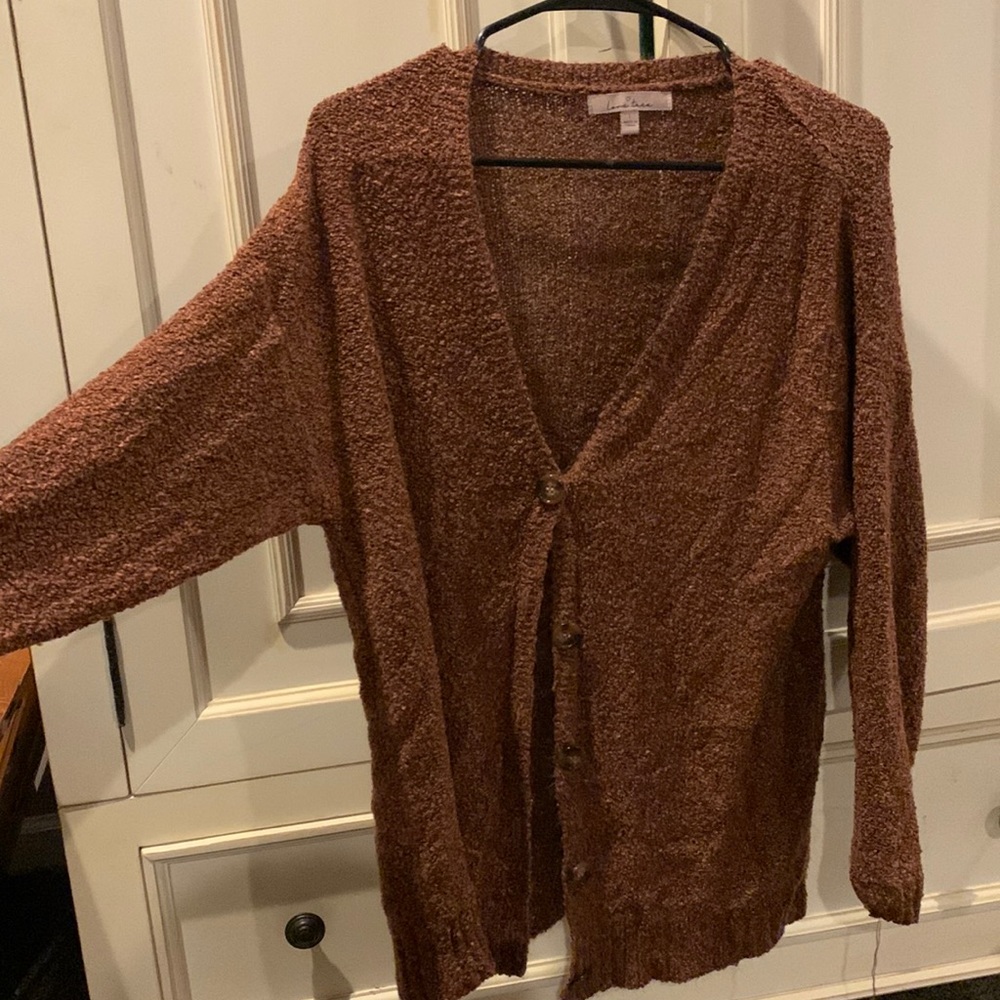 burnt-orange cardigan